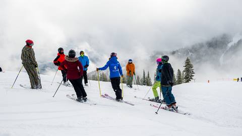 ski instructor with group of ski students